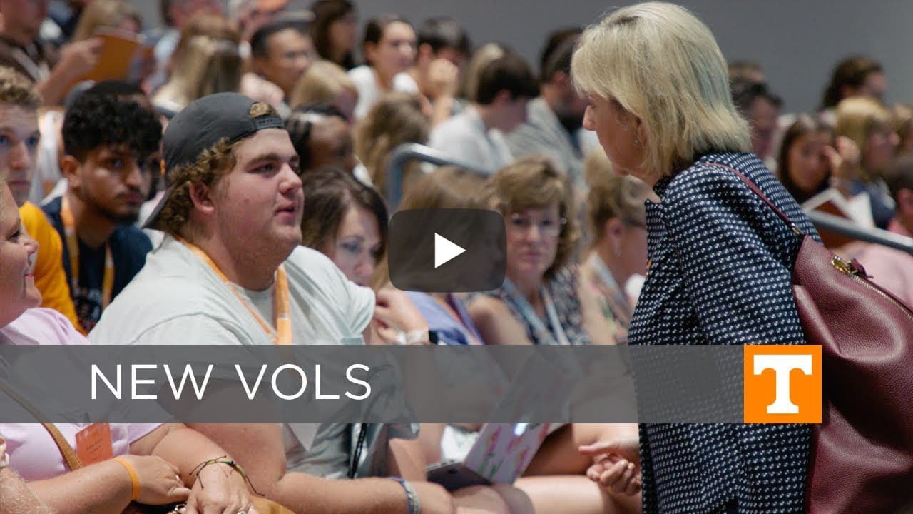 Video still of Chancellor Plowman talking with an incoming freshman at orientation.