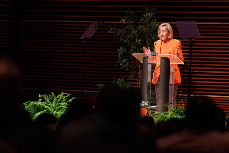 Donde Plowman stands behind a podium as she delivers the sixth annual Flagship Address at the University of Tennessee.