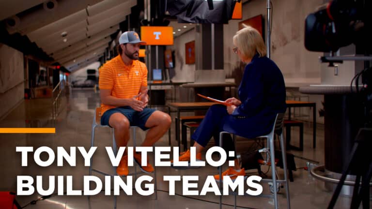 Coach Tony Vitello sits across from Chancellor Donde Plowman during an interview in Neyland Stadium.