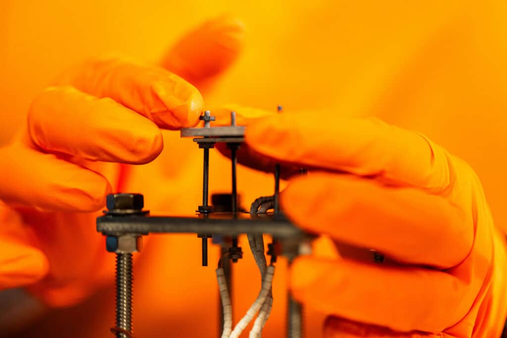 A detail image as graduate student Katie Butler mounts a tungsten sample to a plasma exposure heating stage for the Tennessee Plasma Exposure Experiment (T-PLEX) in the Nuclear Fusion Lab at Zeanah Engineering Complex.